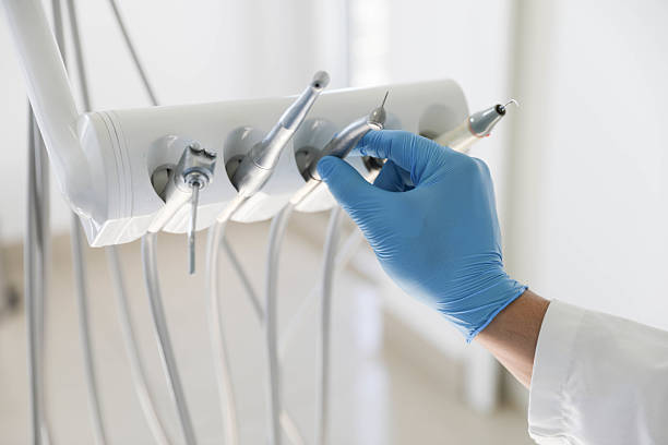 Professional Tooth Extraction technician working in Sioux City, IA